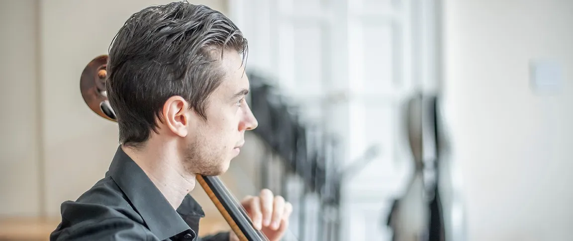a beautiful picture of Nicola Siagri playing cello