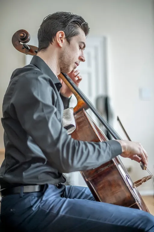 a beautiful picture of Nicola Siagri playing cello