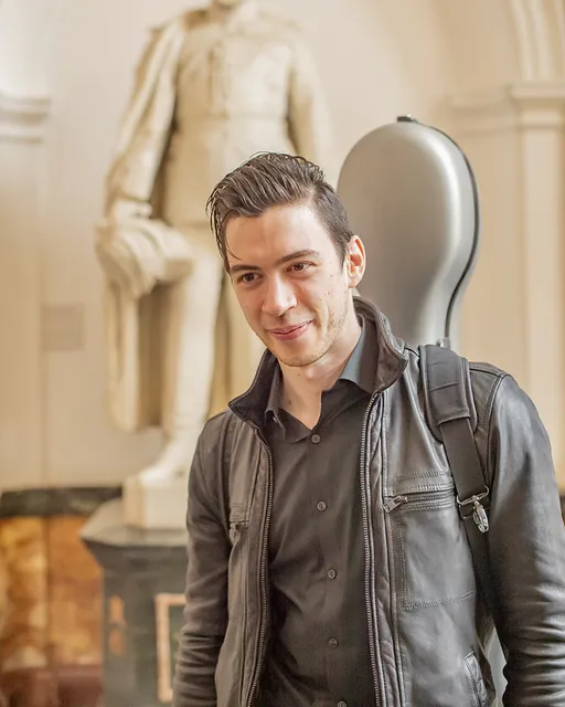 a beautiful picture of Nicola Siagri with his trusty cello case